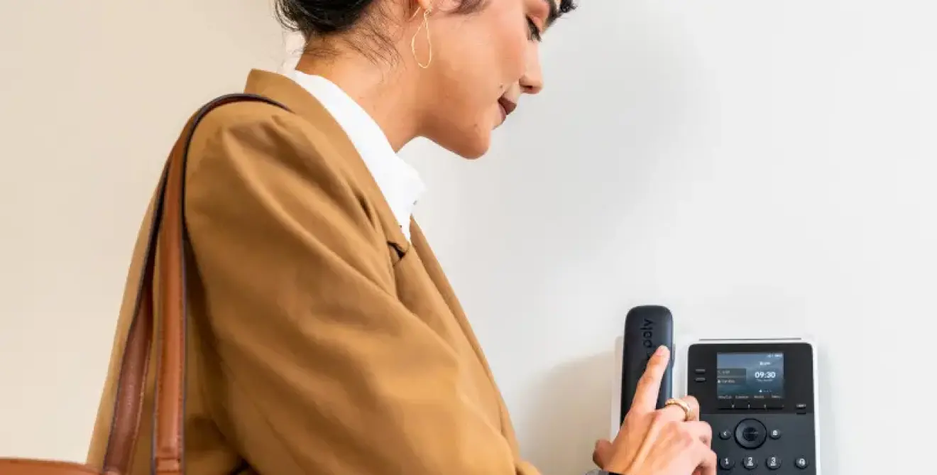 Poly Edge E100 Ip Phone Ip Desk Black Lifestyle Woman In Common Area Sup M2805720