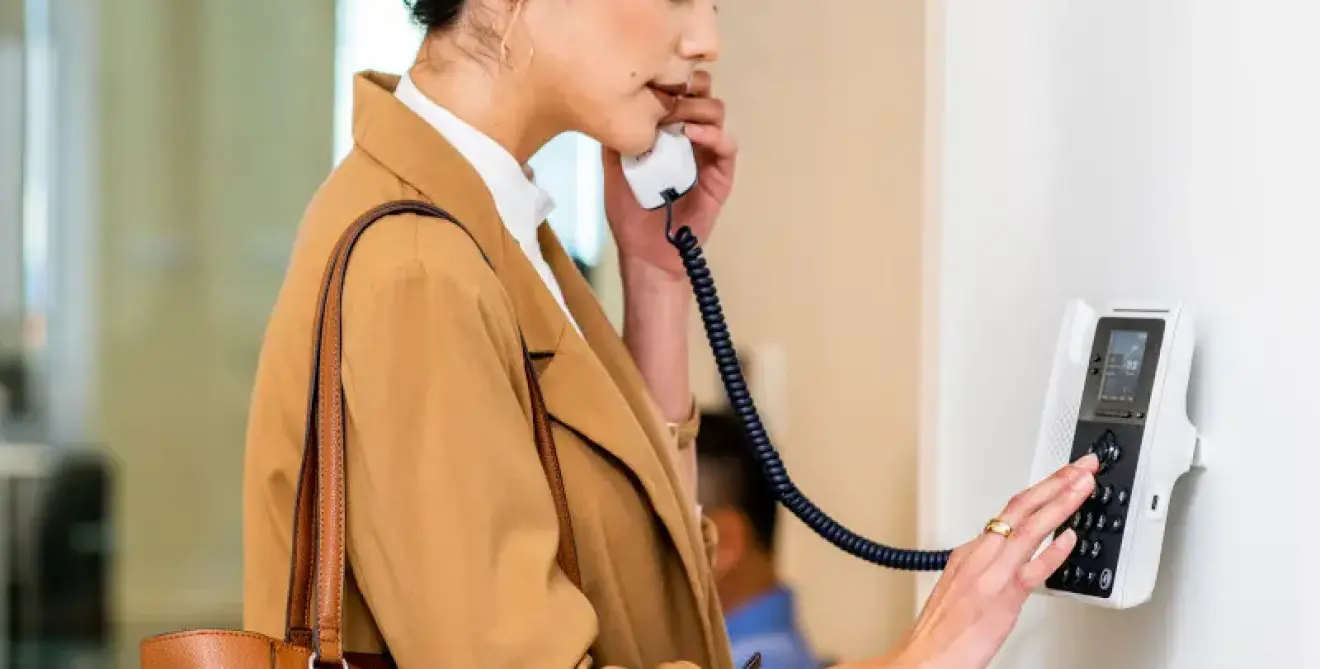 Poly Edge E100 Ip Phone Ip Desk Black Woman In Common Area Lifestyle 2 M2865579